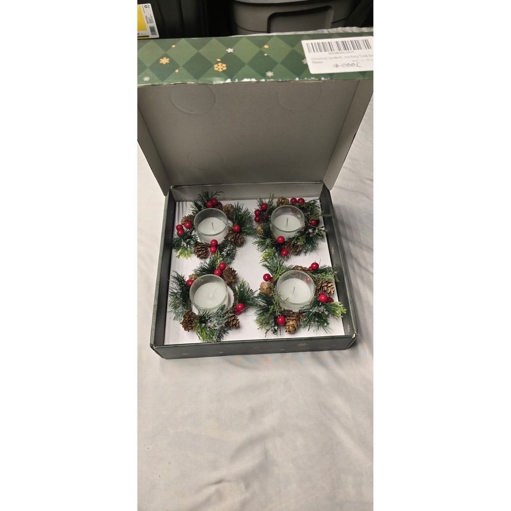 Christmas Candle Rings featuring votive holders with red berries and pinecones